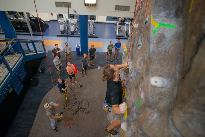 students on wvu climbing wall